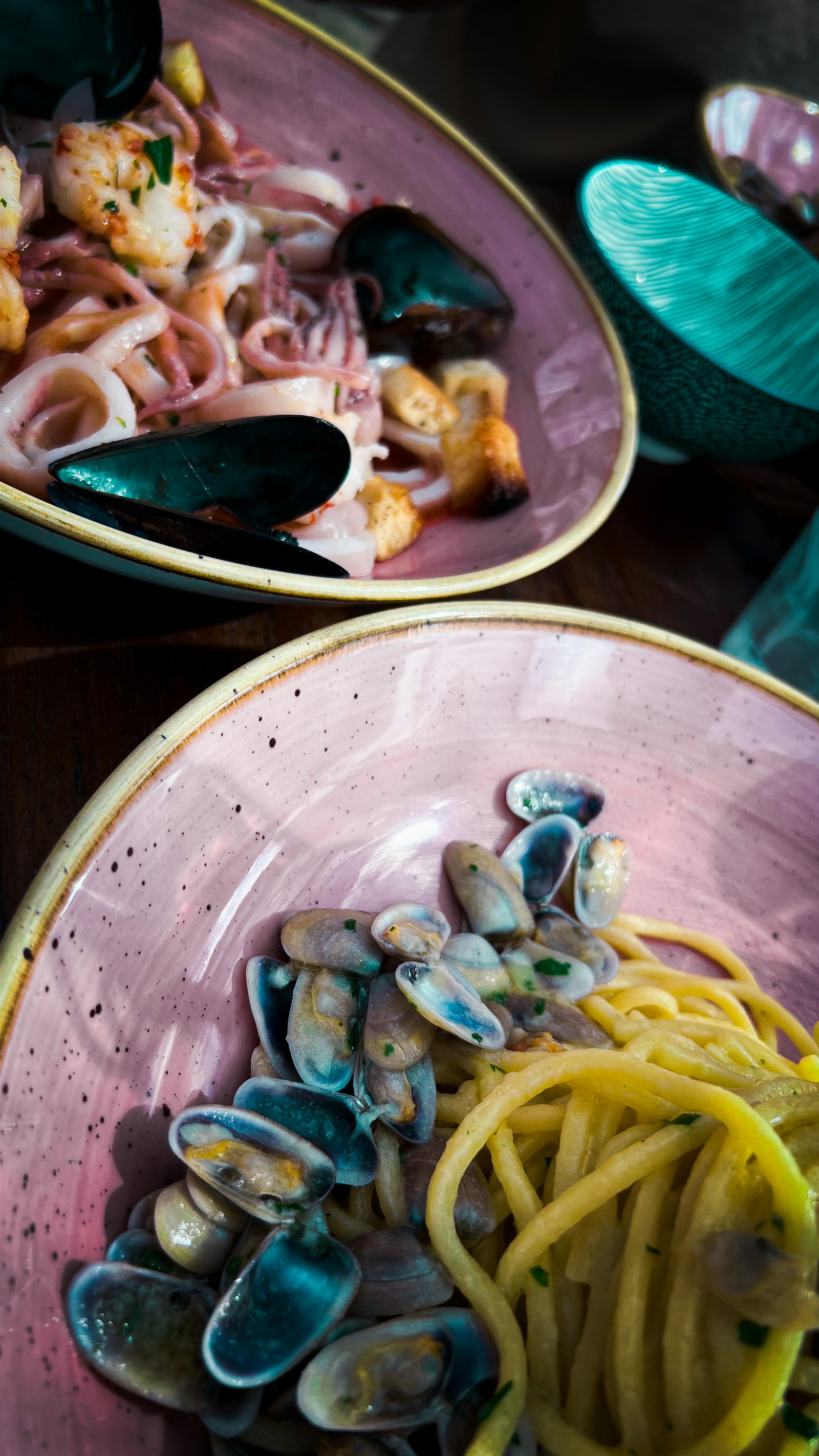 A plate of seafood pasta photographed in Rome