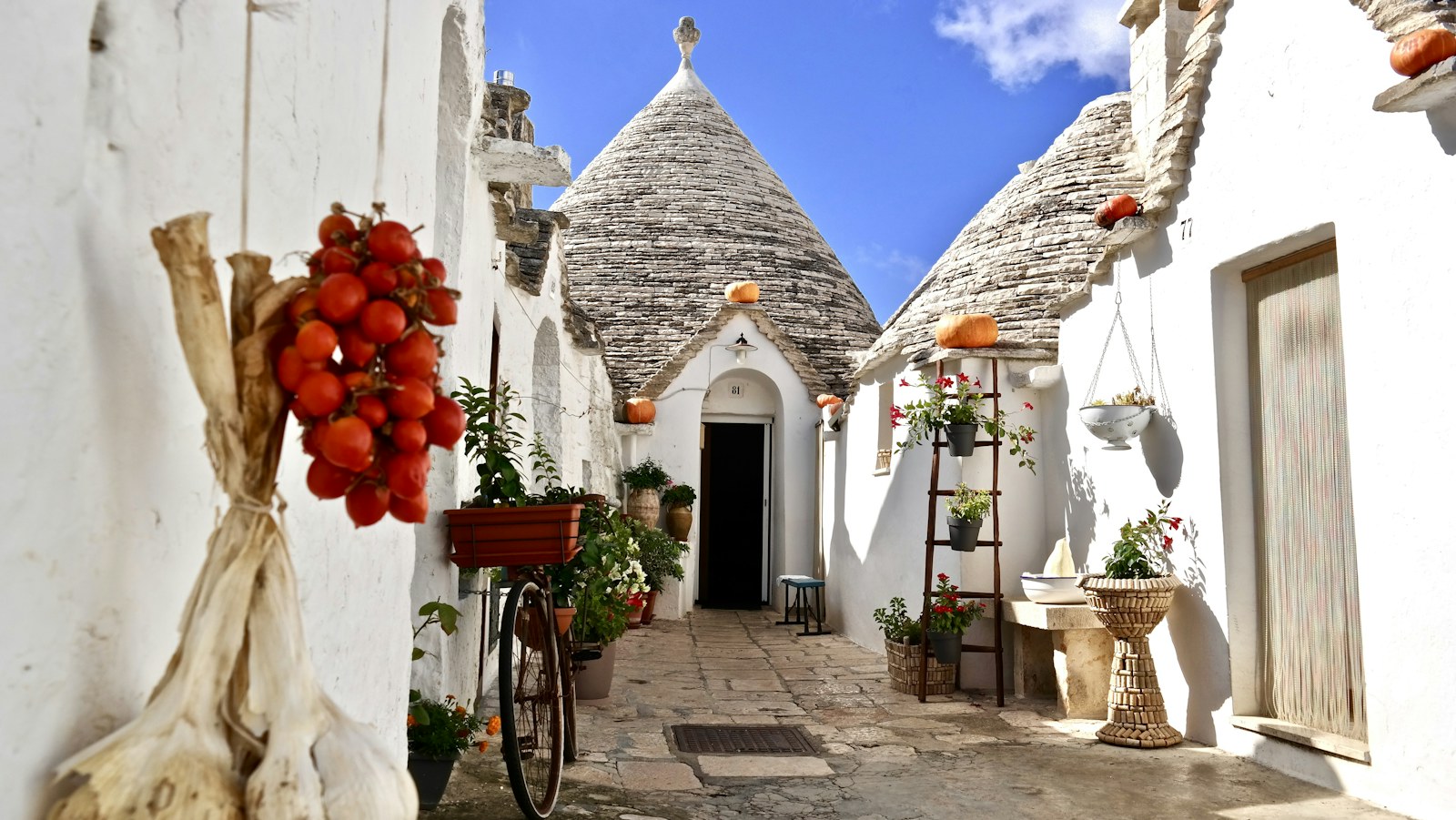 White trulli houses and a narrow lane in Alberobello